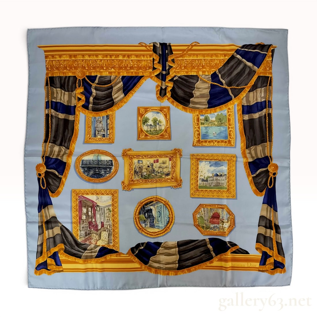 Christian Dior Vintage Silk Scarf with Trompe-l'Oeil Gallery Design: Vintage Christian Dior square silk scarf featuring a light blue ground and a trompe-l'oeil composition depicting a gallery or theater setting. The design is bordered by draped, gold-fringed curtains w