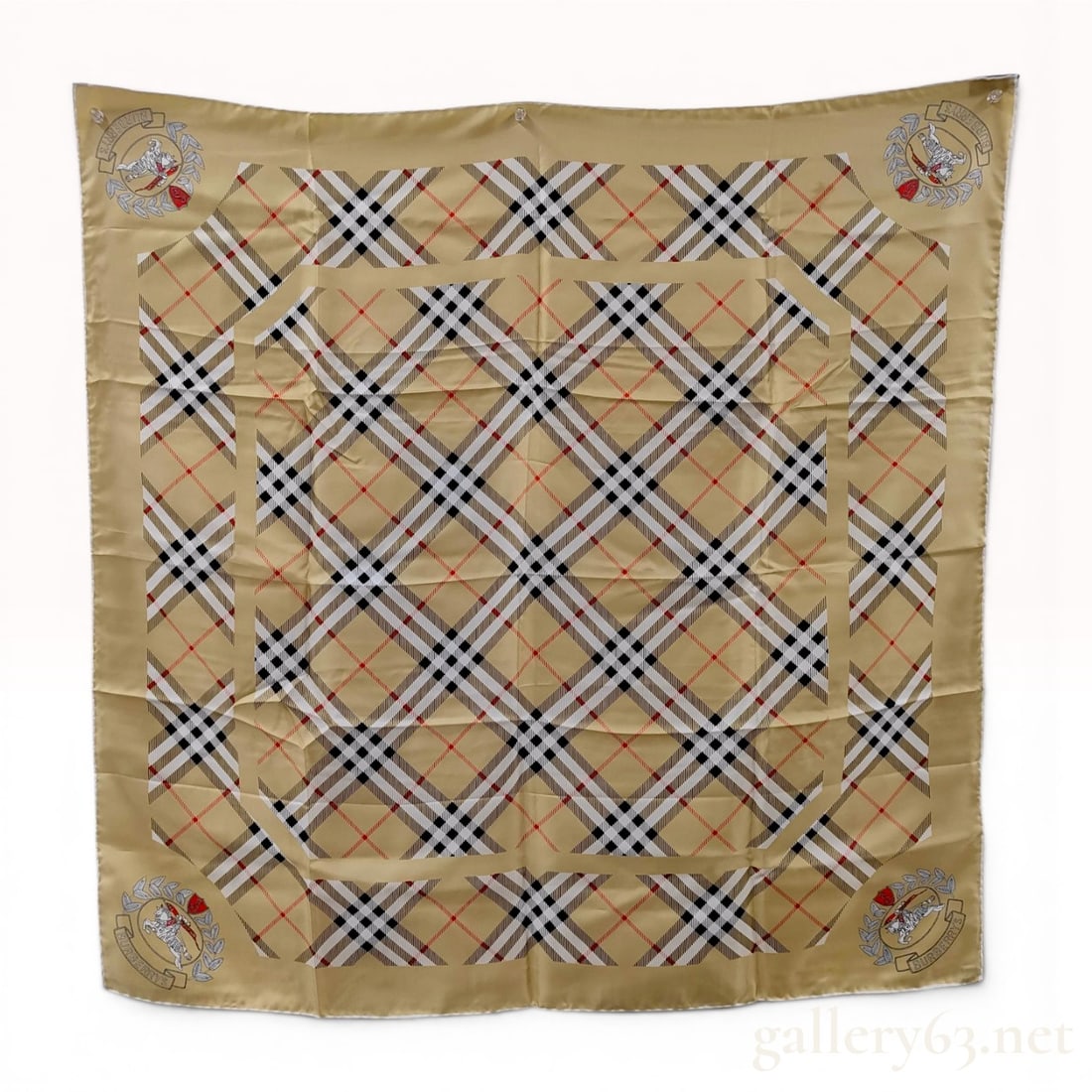 Burberrys Vintage Nova Check and Equestrian Knight Silk Twill Scarf: Vintage Burberrys square silk twill scarf, circa 1990s. The design features a diagonal Nova check pattern on a tan ground with four large equestrian knight crests and hand-rolled edges. A navy blue fa