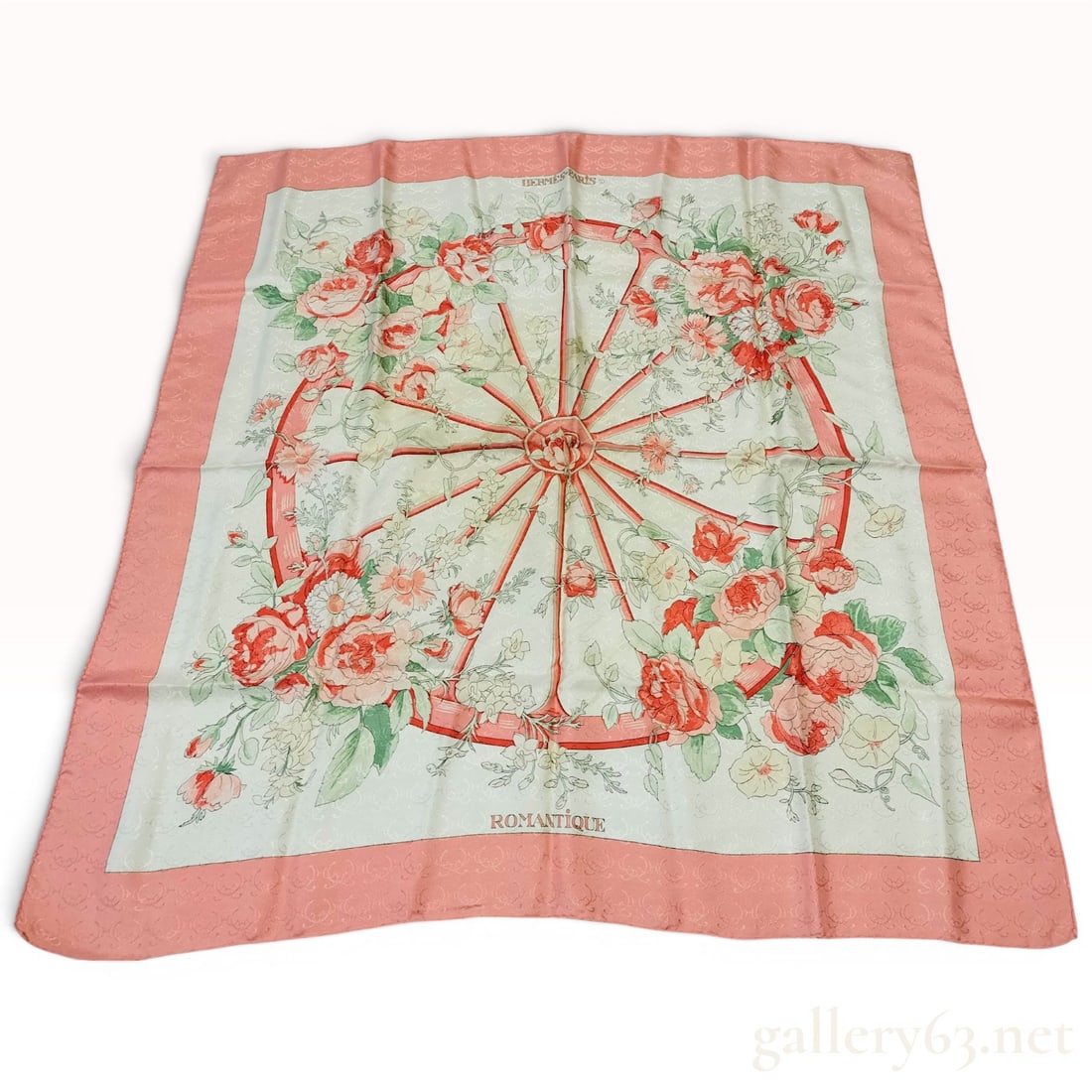 Hermes Romantique Jacquard Silk Scarf by Maurice Tranchant: Hermès Paris silk jacquard scarf in the Romantique pattern designed by Maurice Tranchant, originally issued circa 1971. The peach border and twelve-spoked carriage wheel are decorated with mult