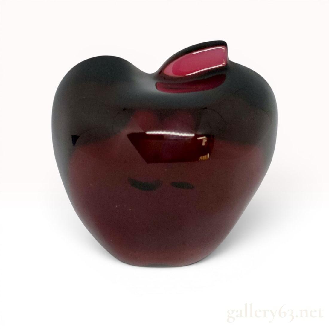 Baccarat Ruby Red Crystal Apple Paperweight: Baccarat ruby red lead crystal paperweight in a stylized apple or heart form, late 20th century. The heavy glass features a deep garnet color transitioning to a translucent red center. The base is mar