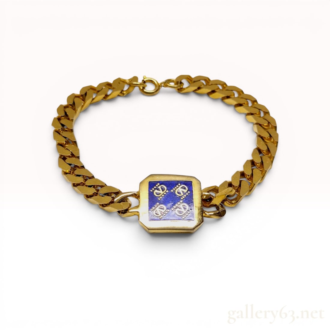 Valentino Vintage Gold-Tone Curb Link Bracelet with Blue Enamel Logo Plaque: This vintage curb link chain bracelet is by Valentino. The central feature is a square-shaped plaque with canted corners, displaying a royal blue enamel field decorated with four gold-tone coronet-top