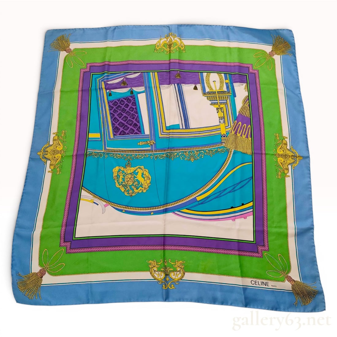 Celine Paris Silk Square Carriage Motif Scarf: A square silk scarf from the fashion house Celine Paris. The piece is constructed of 100 percent silk and was manufactured in Italy. The design features a central equestrian-themed illustration of a b