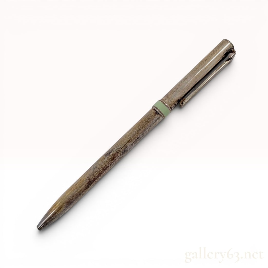 Tiffany and Co. Sterling Silver T-Clip Ballpoint Pen with Enamel Band with Box: A ballpoint pen by Tiffany and Co. crafted in sterling silver. The pen features a signature Tiffany Blue enamel band situated near the cap ring and utilizes a retractable mechanism integrated into the