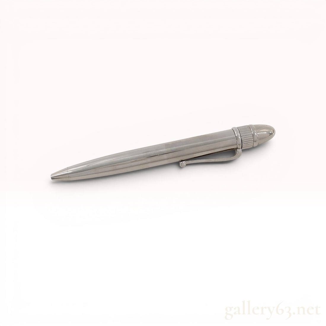 Rolex Executive Fluted Twist-Action Ballpoint Pen with Presentation Box: This Rolex executive ballpoint pen is constructed of polished silver-toned metal. The design features a streamlined barrel and a fluted top finial, echoing the aesthetic of the brand's luxury timepiec