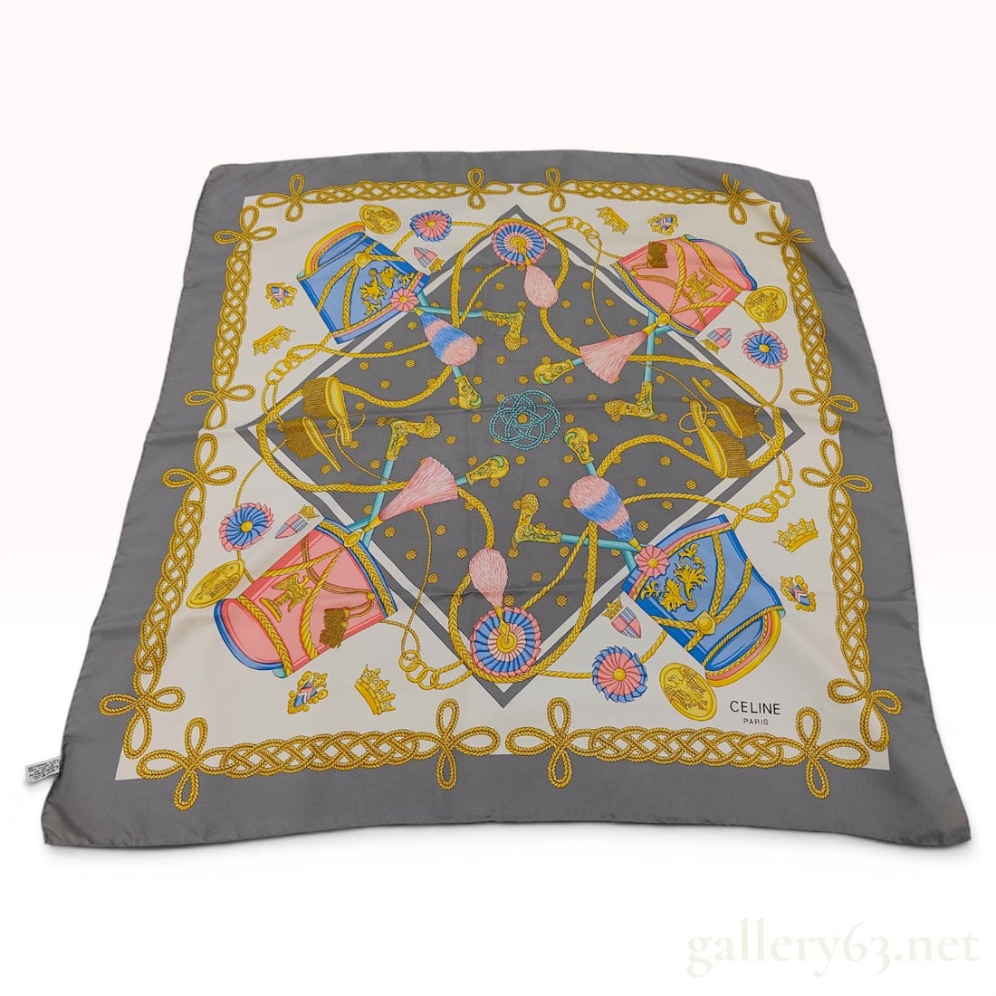 Celine Paris 100% Silk Scarf with Imperial Military Shako and Eagle Motif: This square silk scarf by Celine Paris features an elaborate military-themed design. The pattern includes four shako-style military hats in alternating shades of pink and blue, each decorated with gol