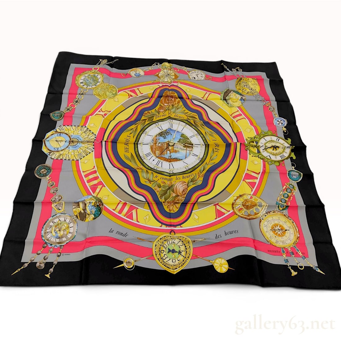 Hermes Silk Carre 90 Scarf La Ronde des Heures by Loic Dubigeon: An Hermes 100 percent silk scarf, known as a Carre 90, featuring the design La Ronde des Heures by artist Loic Dubigeon. The central circular motif displays a clock face with a landscape scene showing