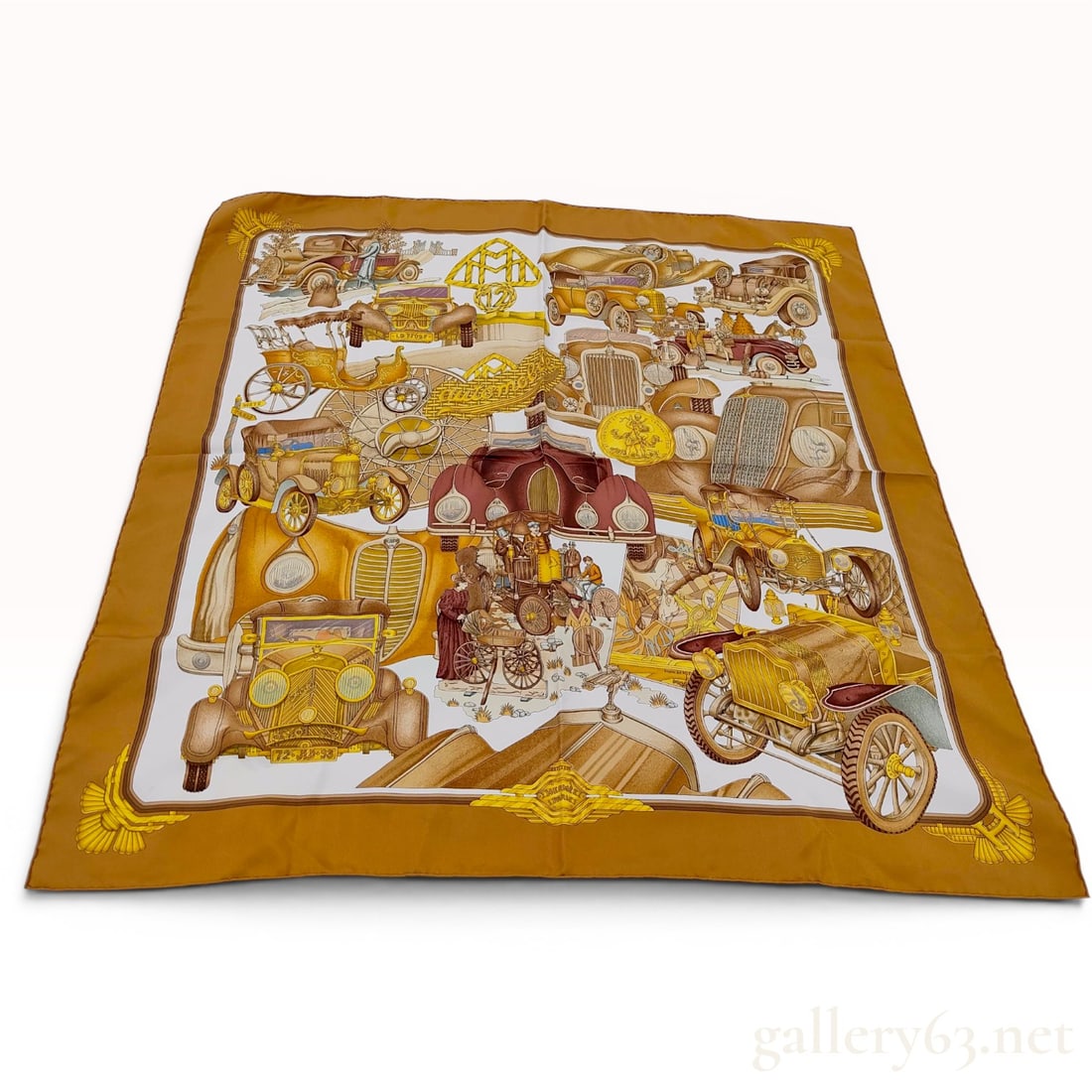 Hermes Les Automobiles Silk Scarf: This Hermes silk carre scarf features the Les Automobiles pattern, a classic design originally created by artist Francoise de la Perriere. The intricate motif presents a comprehensive montage of early