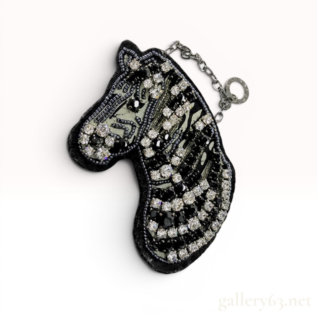 Anteprima Crystal and Beaded Zebra Head Combination Brooch and Bag Charm: This combination brooch and bag charm by Anteprima features a stylized zebra head in profile. The design is meticulously constructed on a black felt base and is heavily embellished with an array of cl
