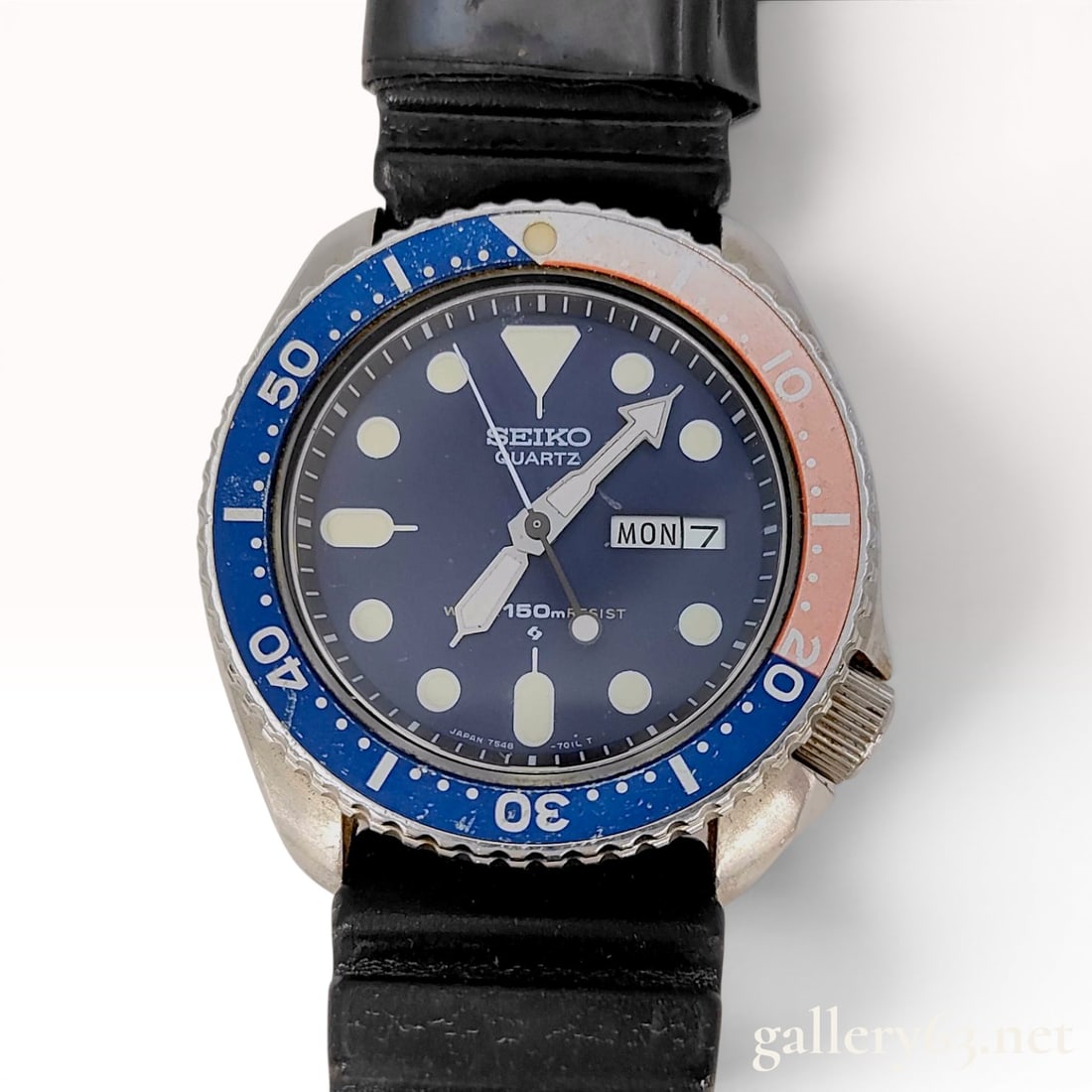Seiko 150m Quartz Diver Watch, Reference 7548-700B: This is a vintage Seiko 150m Quartz Diver wristwatch, reference 7548-700B. The watch features a stainless steel case with a bidirectional rotating "Pepsi" blue and red bezel. The dark blue d