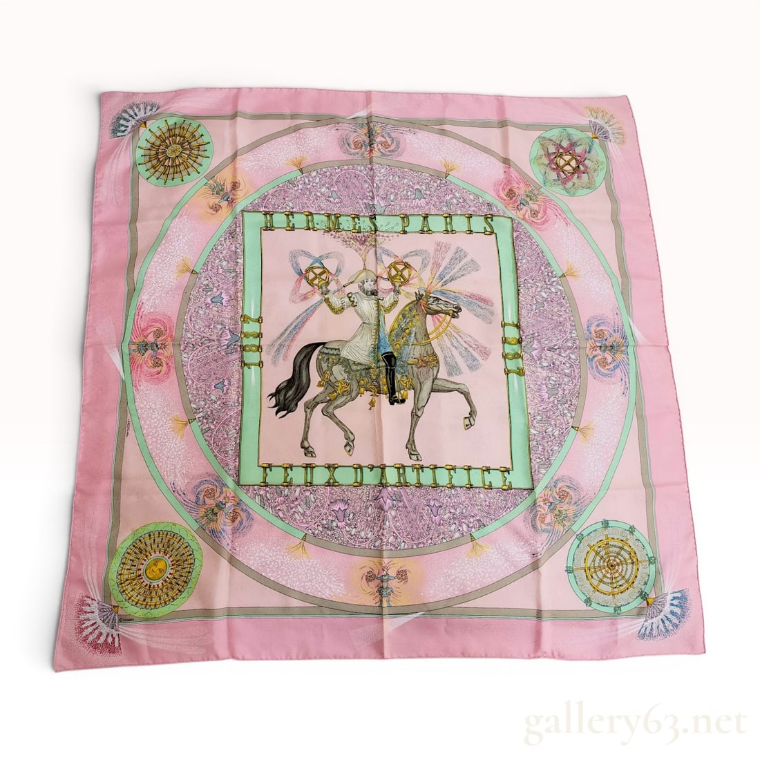 Hermes Feux d'Artifice Pink Silk Jacquard Scarf: This Hermes silk scarf features the Feux d'Artifice (Fireworks) pattern designed by Michel Duchene. Created to commemorate the 150th anniversary of Hermes (1837-1987), the design depicts a central fig