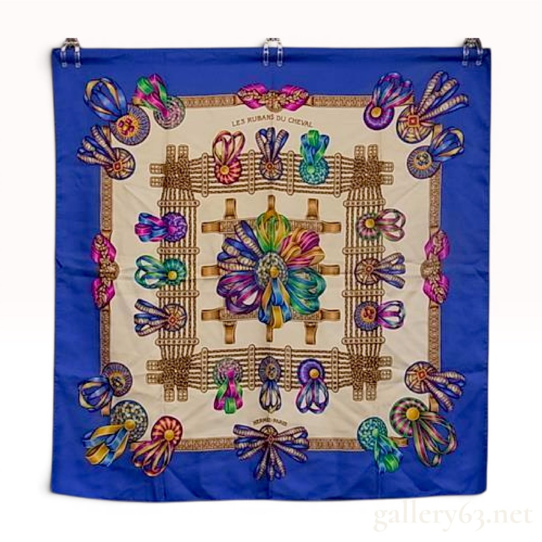 Hermes Silk Scarf Les Rubans du Cheval: This Hermes silk twill scarf, titled Les Rubans du Cheval, was designed by artist Joachim Metz and first issued in 1993. The central motif depicts a large, multicolored rosette composed of prize-winni