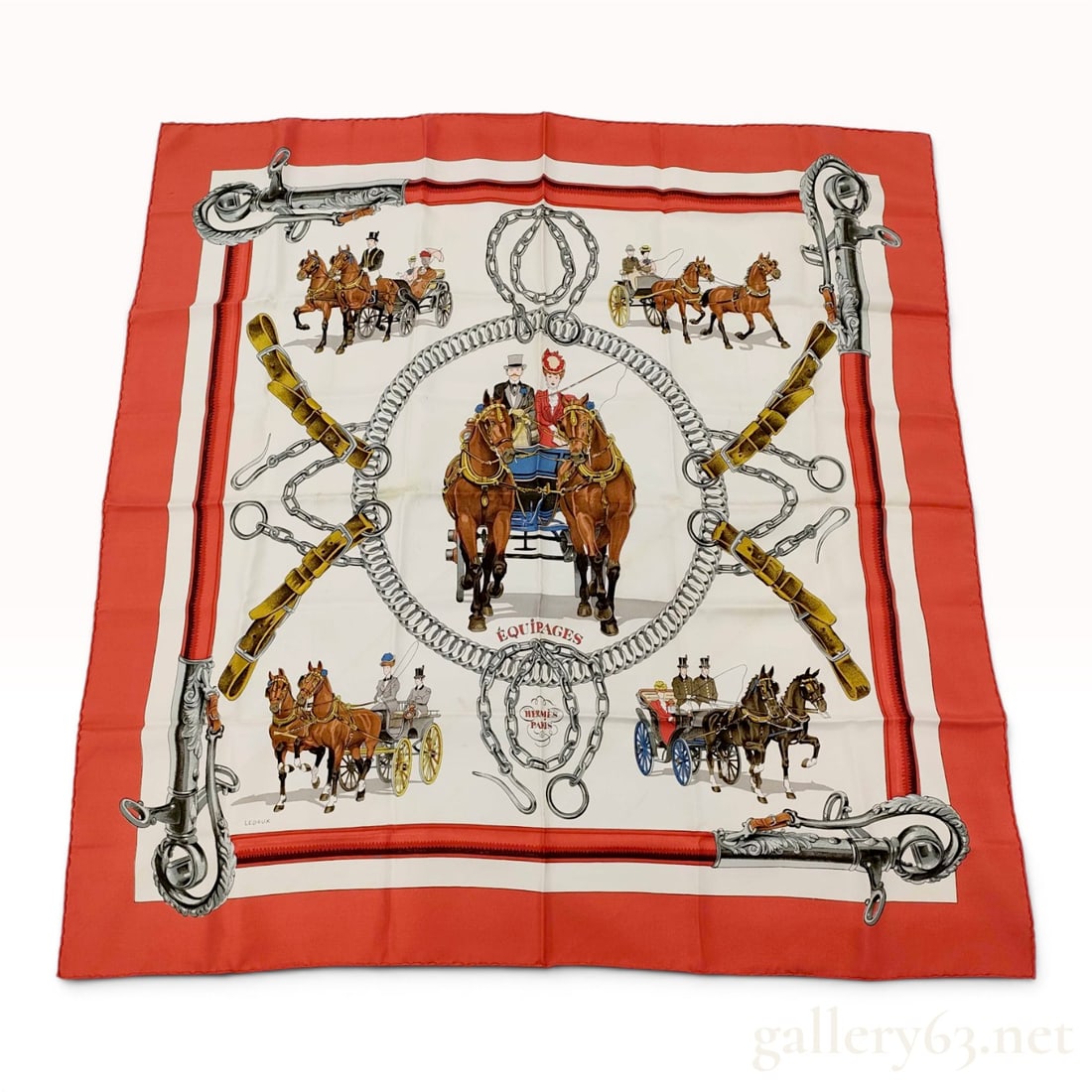 Hermes Silk Carre Scarf in Equipages Pattern by Philippe Ledoux: A vintage Hermes silk carre titled Equipages, designed by artist Philippe Ledoux. The scarf features a central equestrian scene with an ornate horse-drawn carriage enclosed within a circular horse bit