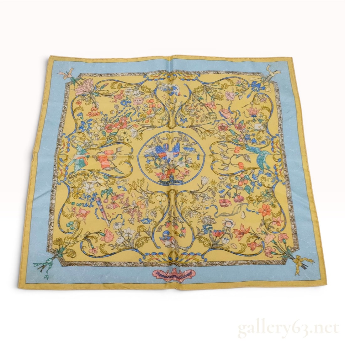 Hermes Pierres d'Orient et d'Occident Silk Gavroche Scarf: This Hermes silk gavroche scarf, also suitable for use as a pocket square, features the Pierres d'Orient et d'Occident pattern designed by Zoe Pauwels. The design centers on a circular medallion depic