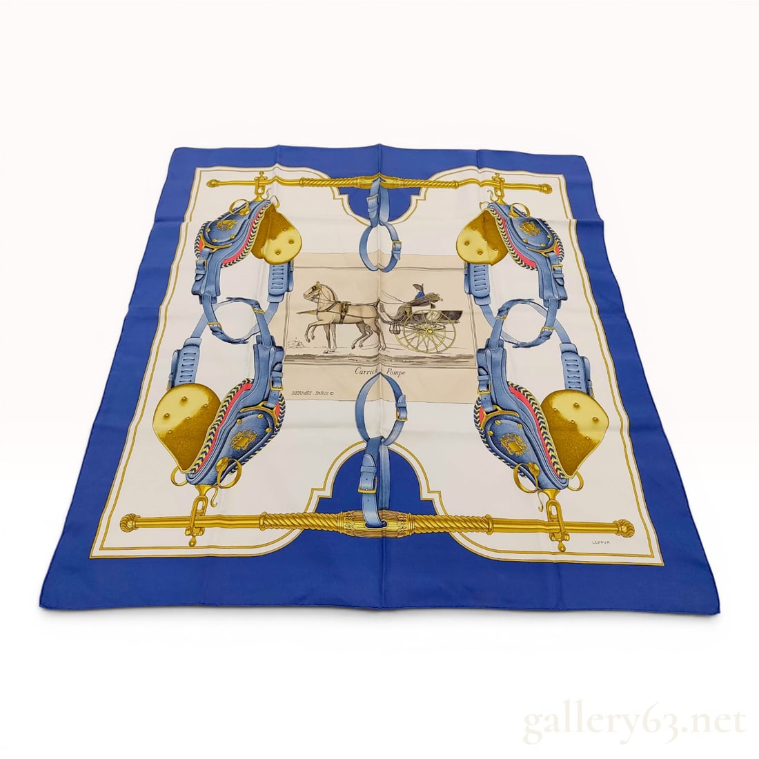 Hermes Carrick Pompe Silk Scarf by Philippe Ledoux: A vintage Hermes silk carre featuring the Carrick Pompe pattern designed by artist Philippe Ledoux. The central design depicts a horse-drawn carriage with a driver, framed by an elaborate border of eq