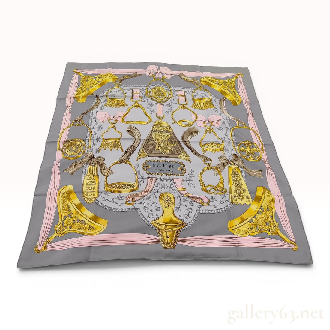 Hermes Etriers Silk Scarf by Francoise de la Perriere: A 100% silk twill scarf from the French luxury house Hermes, featuring the Etriers pattern designed by artist Francoise de la Perriere. The design depicts a symmetrical arrangement of various ornate, 