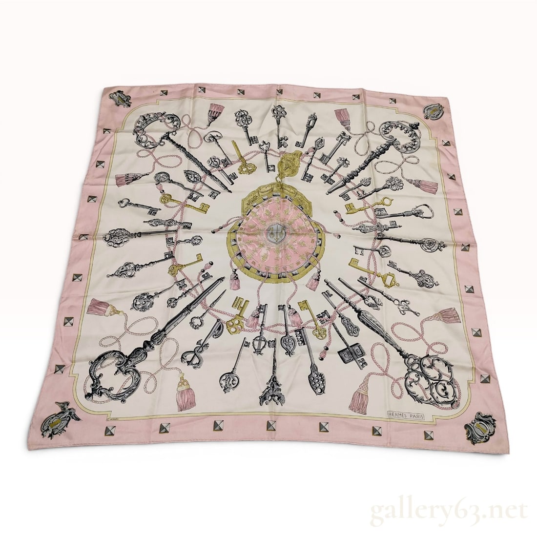 Hermes Les Clefs Silk Scarf by Caty Latham: A Hermes silk twill scarf featuring the iconic Les Clefs (The Keys) pattern designed by artist Caty Latham. Originally introduced in 1965, the composition centers on a decorative key pouch surrounded 