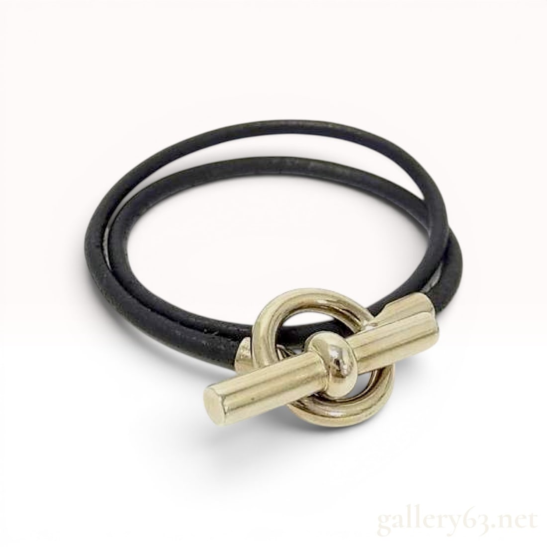 Hermes Glenan Double Tour Leather Bracelet: An Hermes Glenan Double Tour bracelet featuring two strands of black leather cord. The piece is secured with a silver-toned metal toggle clasp consisting of a central spherical T-bar and a circular ri