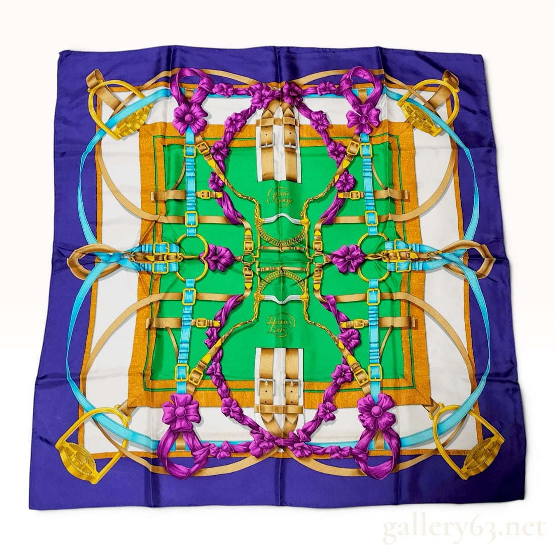 Hermes Grand Manege Silk Scarf Designed by Henri d'Origny: A Hermes silk scarf in the Grand Manege pattern, designed by Henri d'Origny. This square scarf is crafted from 100 percent silk twill and features a hand-rolled hem. The equestrian-themed design featu