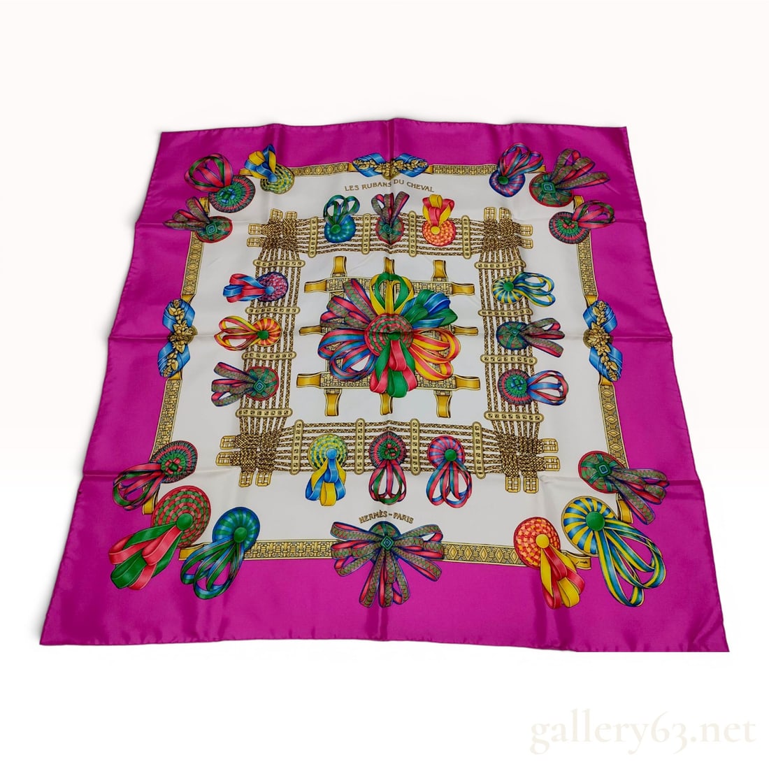 Hermes Les Rubans du Cheval Silk Scarf by Joachim Metz: Hermes silk twill scarf titled Les Rubans du Cheval, or The Horse's Ribbons, designed by artist Joachim Metz and first issued in 1988. The design features a white central field decorated with a variet