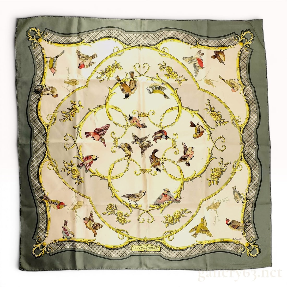 Hermes La Cle des Champs Silk Scarf by Francoise Faconnet: A Hermes silk twill carre scarf featuring the La Cle des Champs (The Key to the Fields) pattern designed by Francoise Faconnet. The central cream-colored field is decorated with various songbirds in f