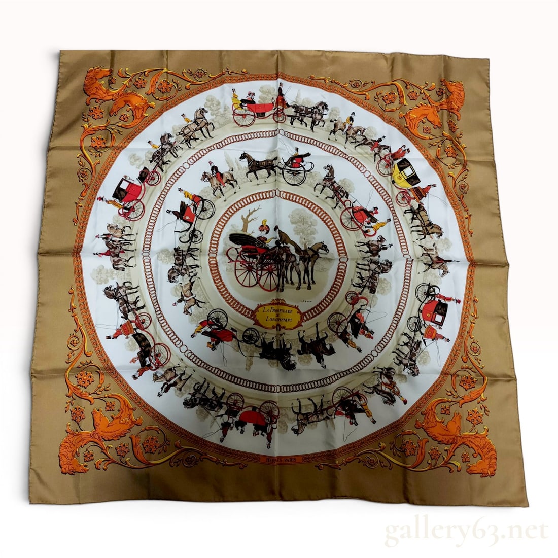 Hermes La Promenade de Longchamps Silk Scarf by Philippe Ledoux: A Hermes silk twill scarf in the La Promenade de Longchamps pattern, originally designed by artist Philippe Ledoux and first issued in 1965. The motif depicts concentric circles of 19th-century horse-