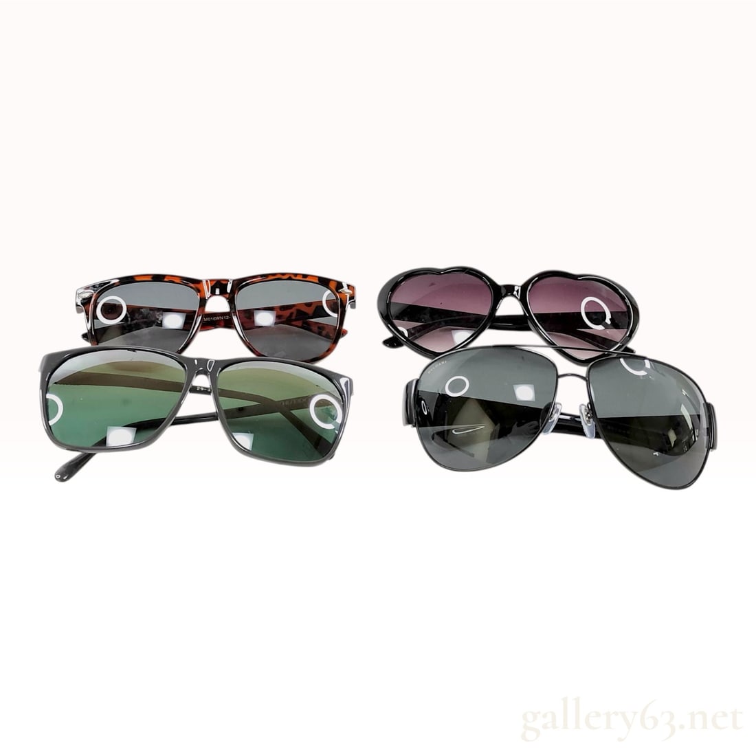 Four Assorted Pairs of Fashion Sunglasses Including Bvlgari and Shiseido: This collection contains four pairs of fashion sunglasses. The first pair is Bvlgari aviator-style sunglasses featuring black metal and plastic frames with a double bridge and dark gray lenses. The in
