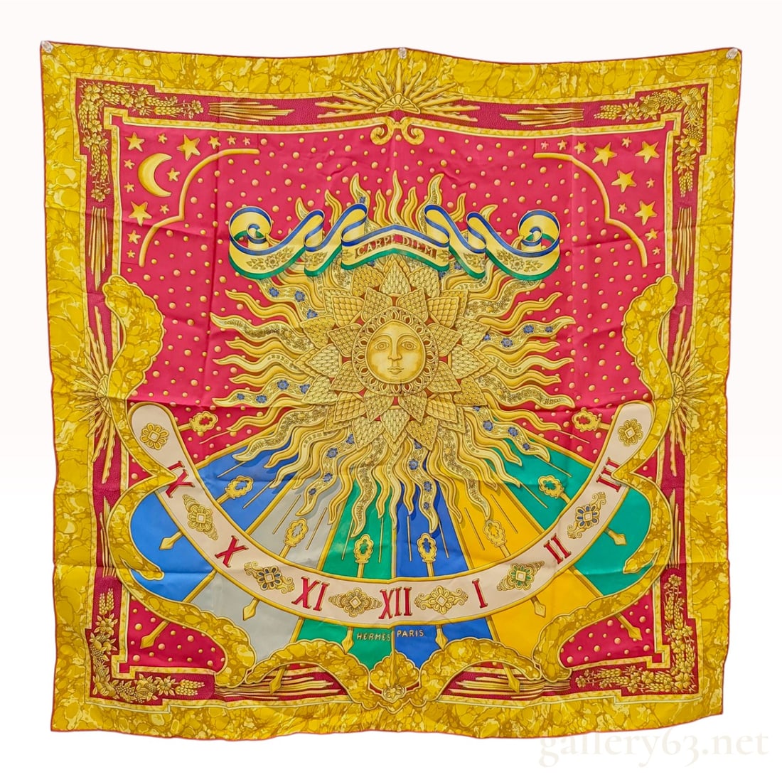 Hermes Carpe Diem Silk Carre 90 Scarf: Hermes Carpe Diem square silk scarf, originally designed by Joachim Metz and first issued in 1994. The design features a central celestial theme with a personified golden sun face radiating beams acro
