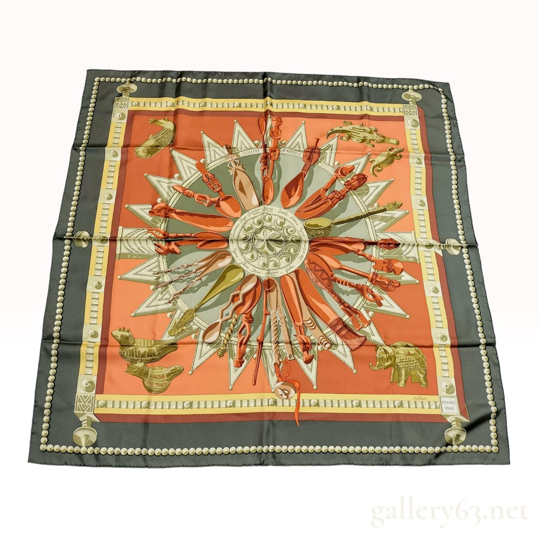 Hermes Cuillers d'Afrique Silk Twill Scarf by Caty Latham: A vintage Hermes silk twill scarf featuring the Cuillers d'Afrique (Spoons of Africa) pattern, designed by artist Caty Latham. The design centers on a radial arrangement of various African tribal spoo