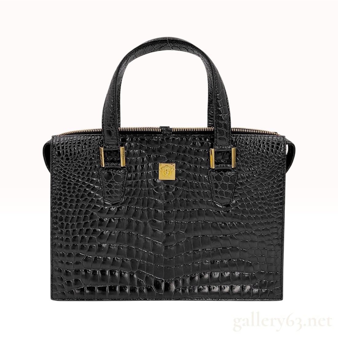 Gianni Versace Vintage Crocodile-Embossed Leather Satchel with Gold-Tone Medusa Hardware: Vintage structured satchel by Gianni Versace. It is constructed from black crocodile-embossed leather and features a rectangular silhouette with double flat top handles. The bag includes a full-length