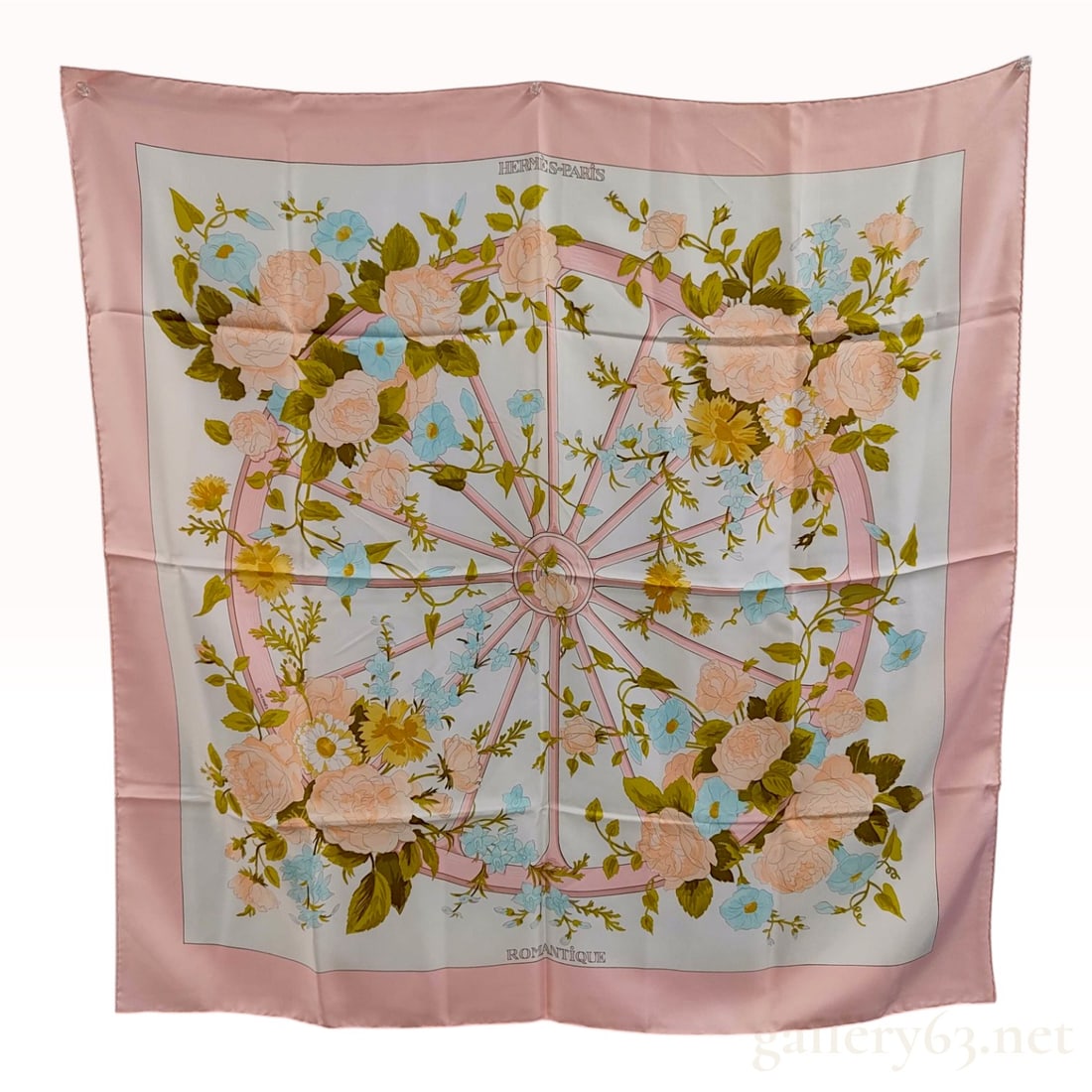 Hermes Romantique Silk Carre 90 Scarf by Maurice Tranchant: This is a vintage Hermes silk twill scarf featuring the Romantique pattern, originally designed by Maurice Tranchant. The composition centers on a pink carriage wheel with spokes radiating outward, en