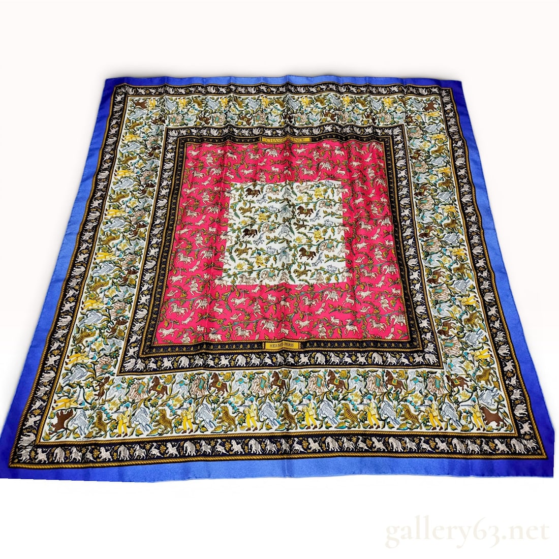 Hermes Chasse en Inde Silk Scarf by Michel Duchene: A vintage Hermes silk twill scarf in the Chasse en Inde (Hunting in India) pattern, originally designed by Michel Duchene and first issued in 1986. The scarf features a complex multi-bordered design d
