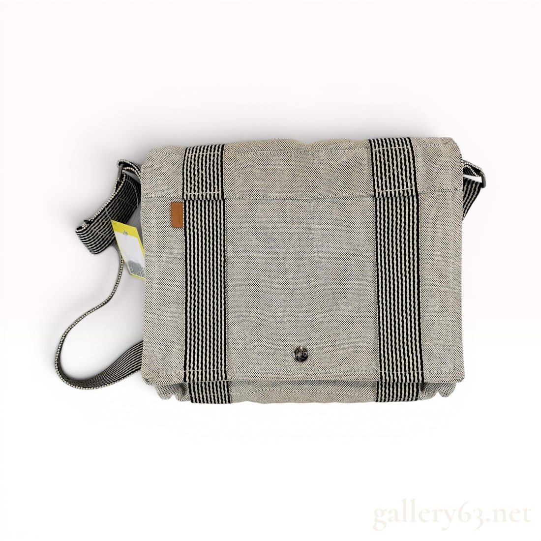 Hermes Herline Besace Canvas Messenger Bag: Hermes Herline Besace messenger bag, constructed from gray canvas with charcoal and white striped webbing accents. The bag is designed with a front flap that secures via a silver-tone snap button embo