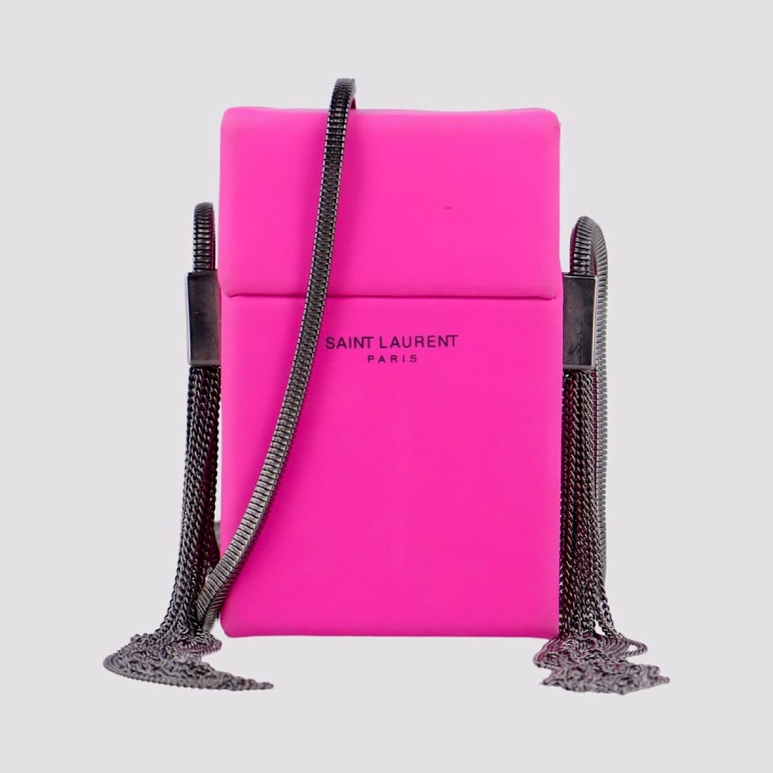 Saint Laurent Paris Fuchsia Satin Smoking Box Mini Bag: This structured evening bag by Saint Laurent Paris is designed in the signature smoking box silhouette, constructed from a hard frame wrapped in bright fuchsia pink satin with a black leather-lined in