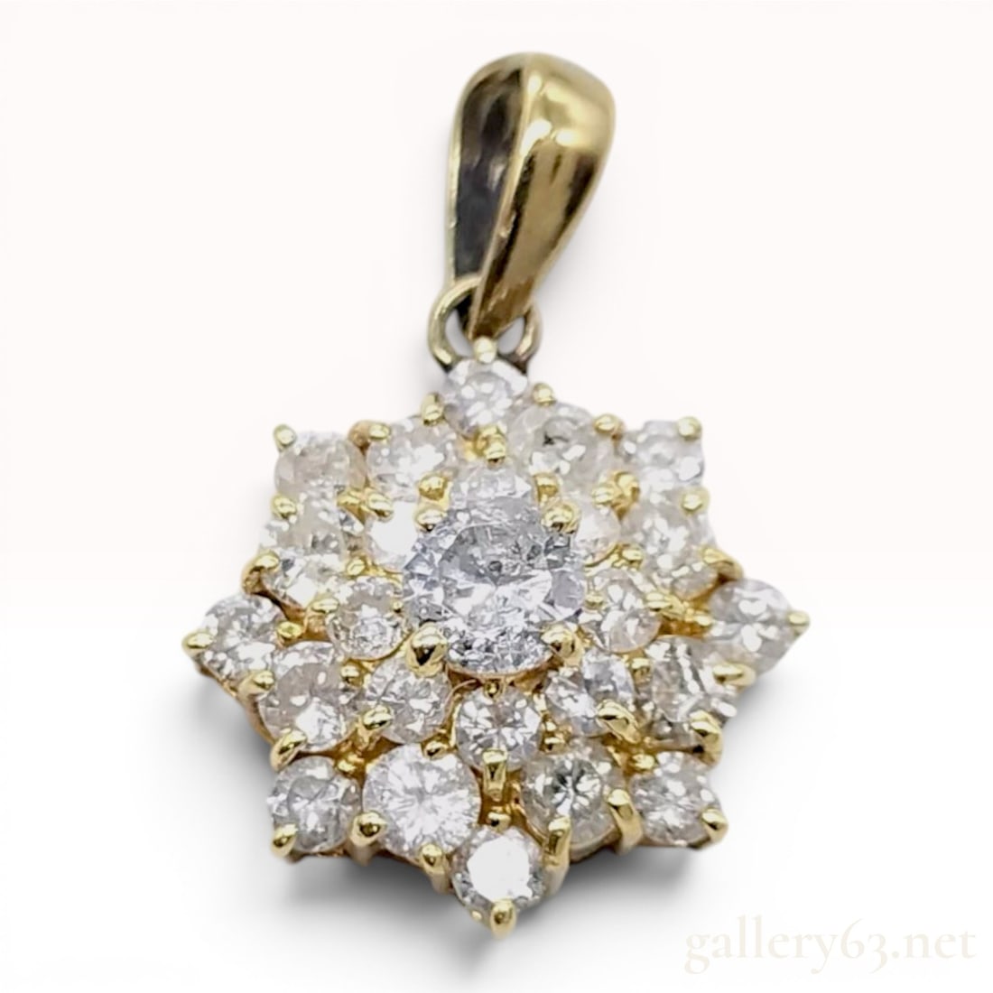 18K Yellow Gold and 1.00ctw Diamond Floral Cluster Pendant: This pendant is crafted in 18K yellow gold and features a tiered floral cluster design. The center of the pendant is set with a single round brilliant-cut diamond, which is encircled by two concentric