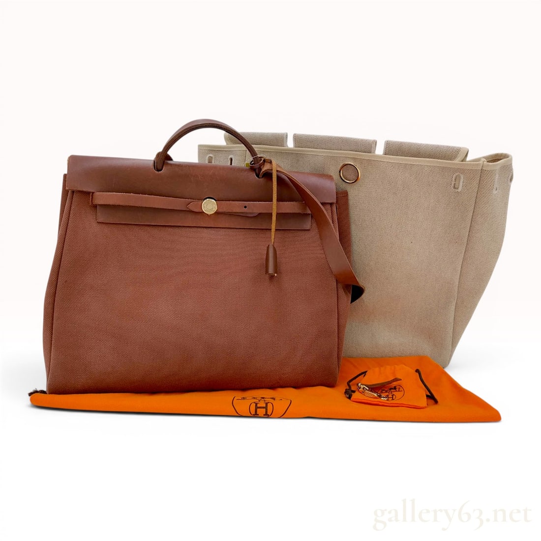 Hermes Herbag PM 2-in-1 Interchangeable Handbag Set: This Hermes Herbag PM 2-in-1 set features an interchangeable design consisting of two canvas bodies and a single leather frame. The set includes one brown canvas body and one tan beige canvas body. Th