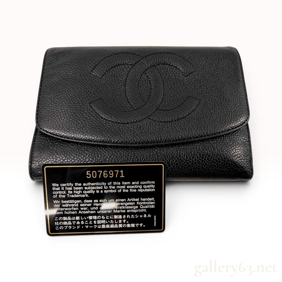 Chanel Timeless CC Stitched Tri-Fold Wallet in Black Caviar Leather: This Chanel tri-fold wallet is constructed from black caviar leather, featuring a pebbled texture. The exterior front flap is decorated with a large, tonal stitched interlocking CC logo. A snap-button