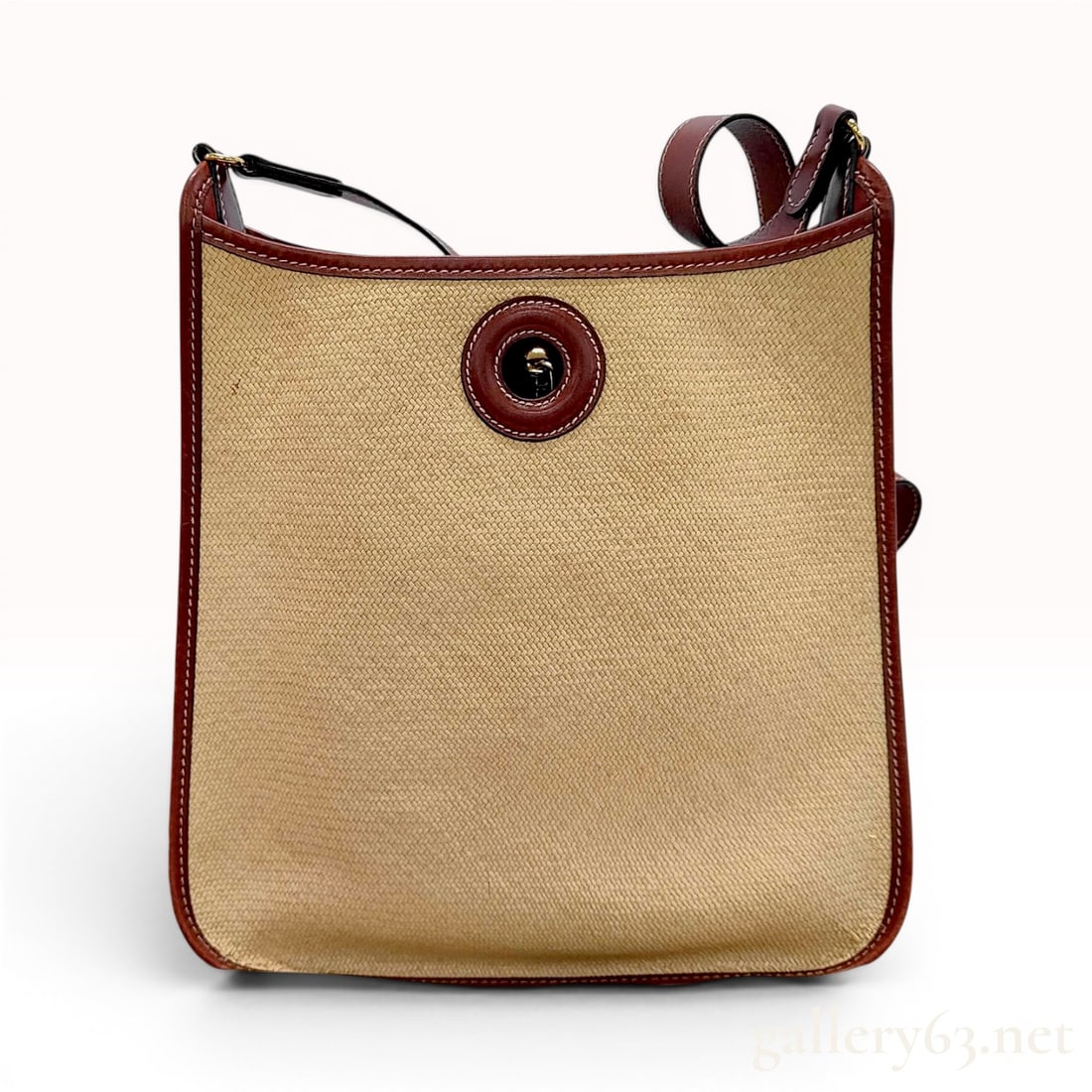 Hermes Vespa PM Shoulder Bag in Toile H and Reddish-Brown Leather: Hermes Vespa PM shoulder bag. This vintage messenger-style bag is constructed with a tan Toile H woven canvas body and reddish-brown leather trim, strap, and base. The bag features a non-adjustable le