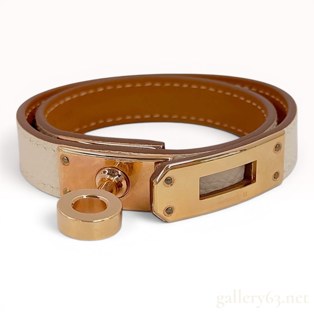 Hermes Kelly Double Tour Leather Bracelet with Box & Pouch with Box: A Hermes Kelly Double Tour wrap bracelet featuring a bicolor leather strap with a cream exterior and a tan interior. The bracelet is fitted with rose gold plated hardware including the signature Kelly