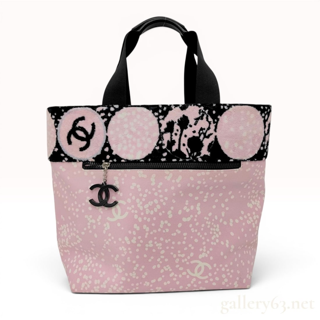 Chanel High Summer Pink and White Patterned Canvas Tote Bag: A Chanel tote bag from the High Summer collection, circa 2005-2006. The exterior is constructed from light pink canvas featuring an all-over white splatter pattern interspersed with the interlocking C