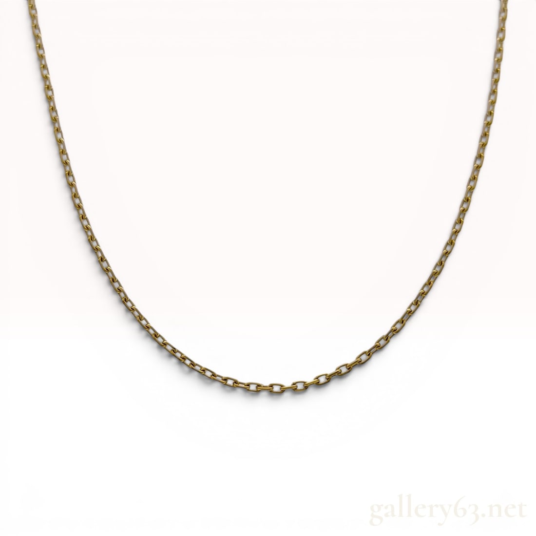 Mikimoto 18 Karat Yellow Gold Cable Link Chain Necklace: A necklace chain by Mikimoto crafted from 18 karat yellow gold. The item features a cable link construction and is secured with a spring ring clasp. A flat end tag is present, displaying the Mikimoto 