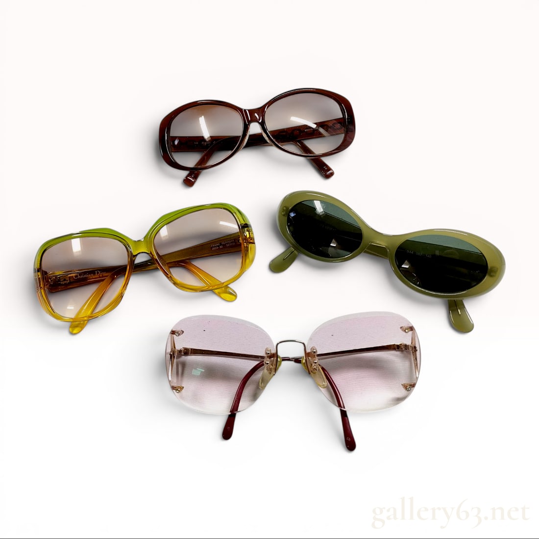 An Assortment of Vintage Designer Sunglasses including Christian Dior and Giorgio Armani: This collection features multiple pairs of vintage designer eyewear in a variety of styles and materials. Included is a pair of Christian Dior Optyl sunglasses with large rounded square frames in a tw