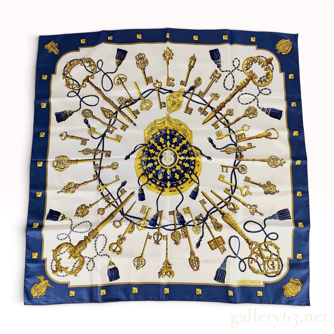 Hermes Les Clefs Silk Scarf designed by Caty Latham: An Hermes "Les Clefs" (The Keys) silk scarf, featuring a design by Caty Latham. The central motif consists of a circular crest with a coat of arms and fleur-de-lis, surrounded by a complex a