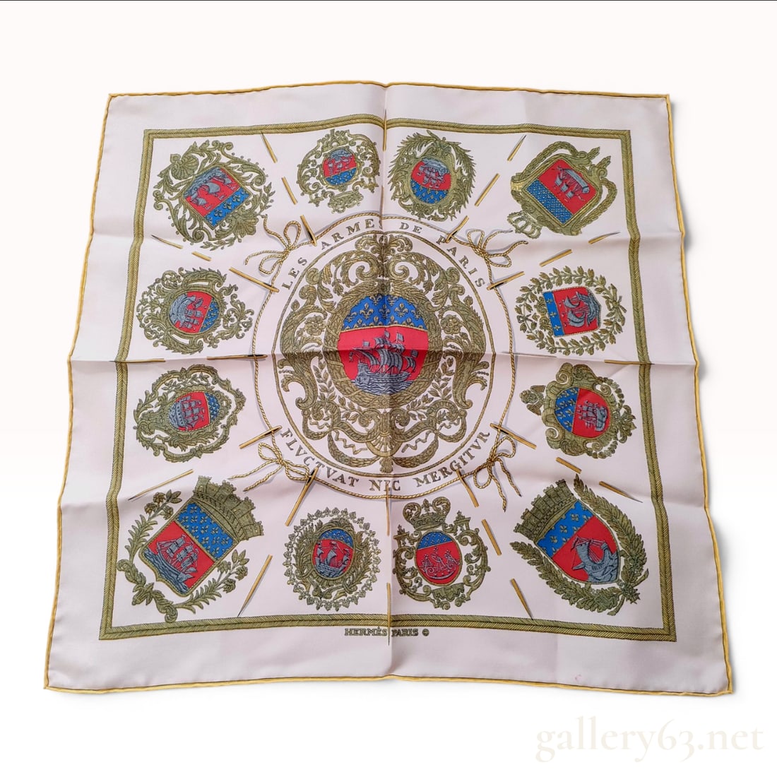 Hermes Les Armes de Paris Silk Gavroche Scarf: A Hermes Paris silk scarf in the Les Armes de Paris pattern, originally designed by Hugo Grygkar. This square gavroche or pocket square is constructed from 100 percent silk twill. The design features 