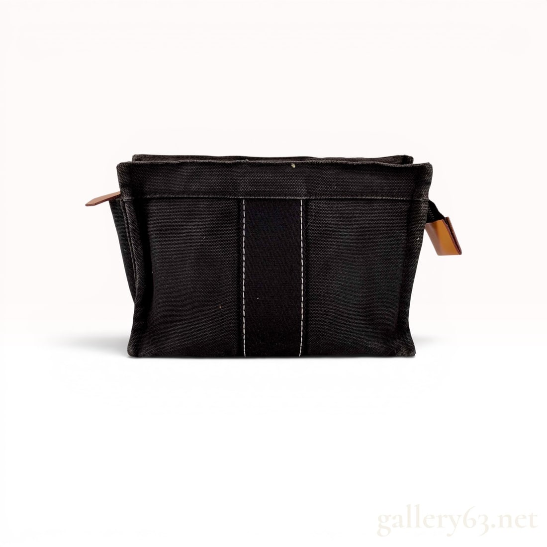 Hermes Black Toile Fourre-Tout Canvas Pouch: This Hermes Fourre-Tout pouch is constructed from durable black cotton canvas (toile). The design features a signature central webbing stripe in a dark charcoal gray tone, accented by white contrast s