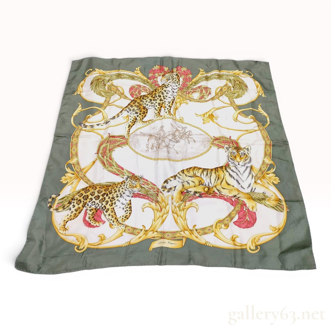 Salvatore Ferragamo Baroque Safari Silk Scarf: This is a square silk scarf from the Italian luxury brand Salvatore Ferragamo, featuring the Baroque Safari pattern. The design is printed on 100% silk twill, evidenced by a visible diagonal weave. Th