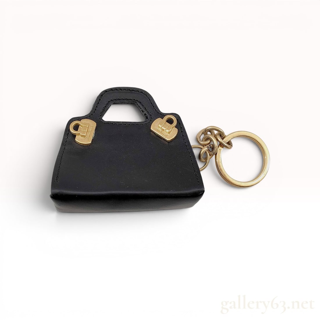 Salvatore Ferragamo Black Leather Wanda Mini Bag Keychain with Box: A Salvatore Ferragamo miniature handbag keychain, designed after the house's signature Wanda silhouette. This bag charm is crafted from smooth black leather and features a structured, trapezoidal form