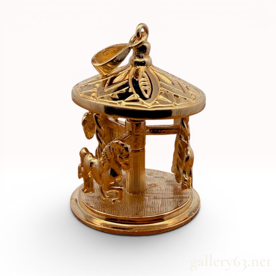14K Yellow Gold Carousel Pendant: In good condition and weighs 11.7 grams. The horses do move. 11.7 grams