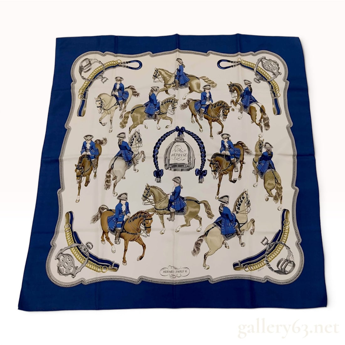 Hermes Reprise Silk Scarf by Philippe Ledoux: This square scarf is crafted from silk twill and features the Reprise pattern designed by Philippe Ledoux for Hermes. The equestrian-themed design depicts riders in 18th-century style blue dressage un