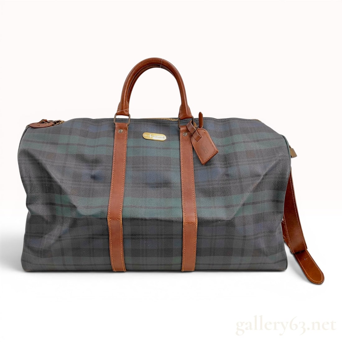 Polo Ralph Lauren Vintage Blackwatch Plaid Large Duffel Bag: A vintage Polo Ralph Lauren large weekender duffel bag featuring the iconic Blackwatch tartan pattern in deep green, navy blue, and black. The bag is constructed from PVC-coated canvas with a pebbled 