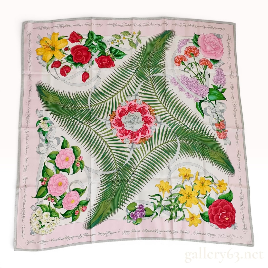 Hermes Fleurs de L'Opera Silk Scarf by Julia Abadie: Hermes Paris silk scarf in the Fleurs de L'Opera pattern, designed by Julia Abadie. The design features a white central field with a starburst of green palm fronds radiating from a central floral